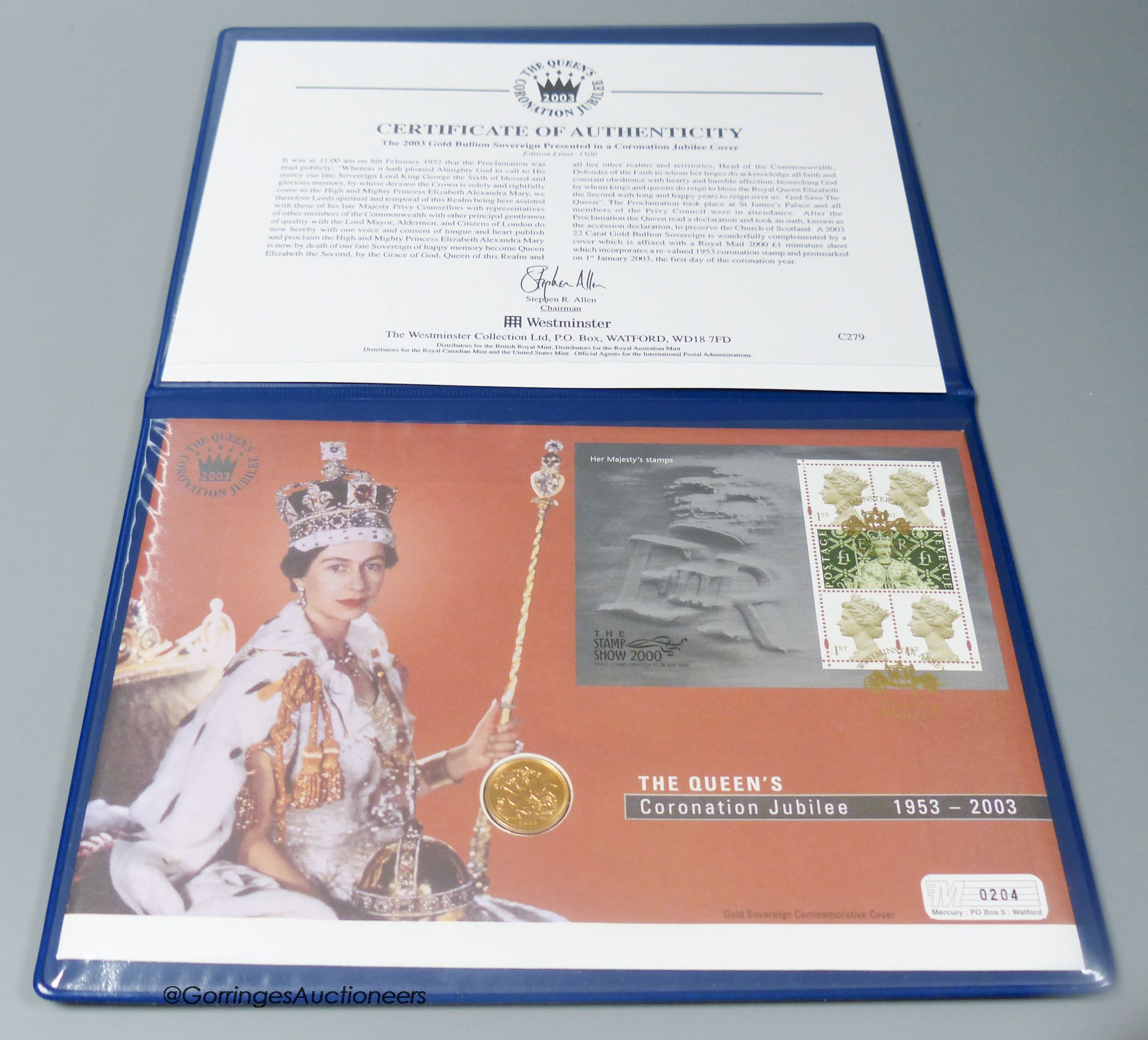 A 2003 gold bullion sovereign presented in a Coronation Jubilee cover, with certificate of authenticity.
